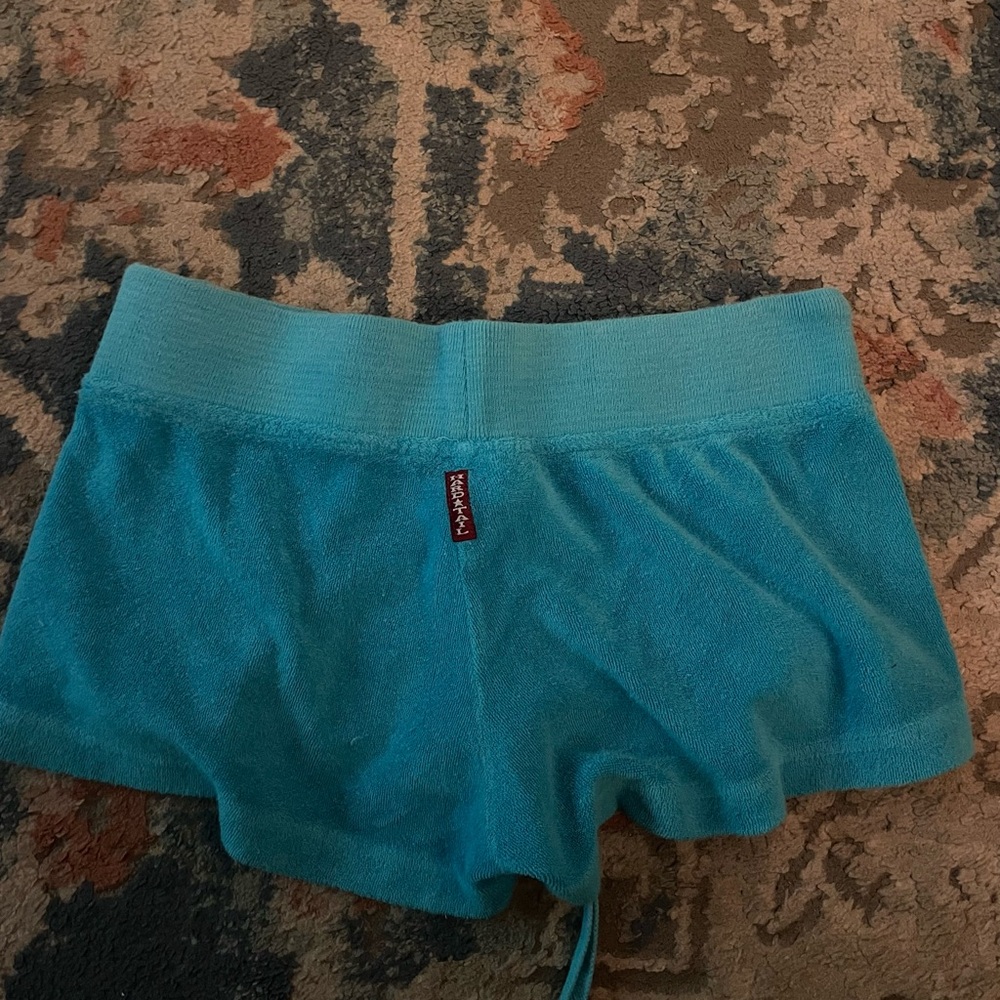 Medium hard tail shorts in cyan/blue color